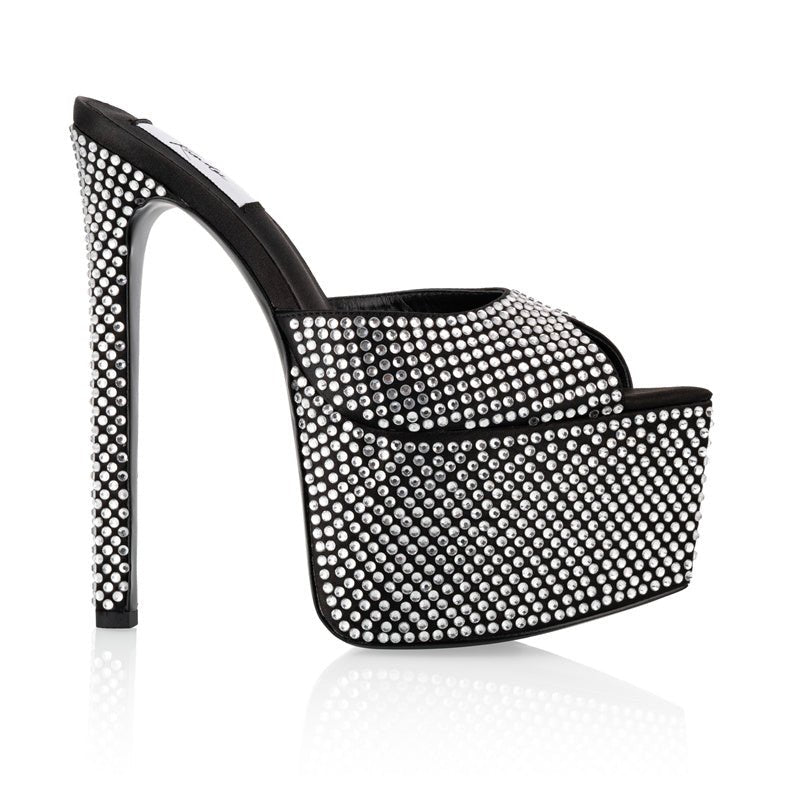 Glamorous black mules featuring chunky platform and full crystal detailing