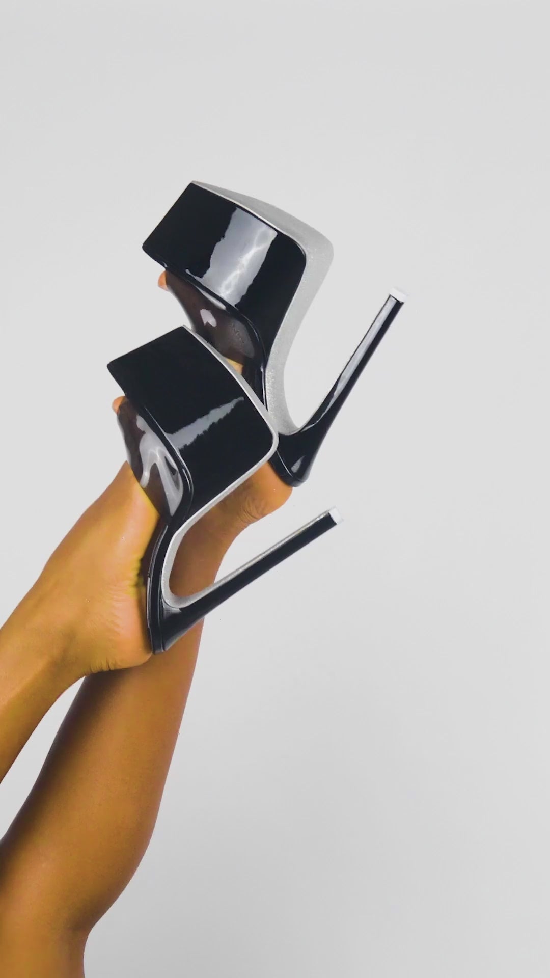 Statement black platform mules with glossy finish and clear PVC detailing