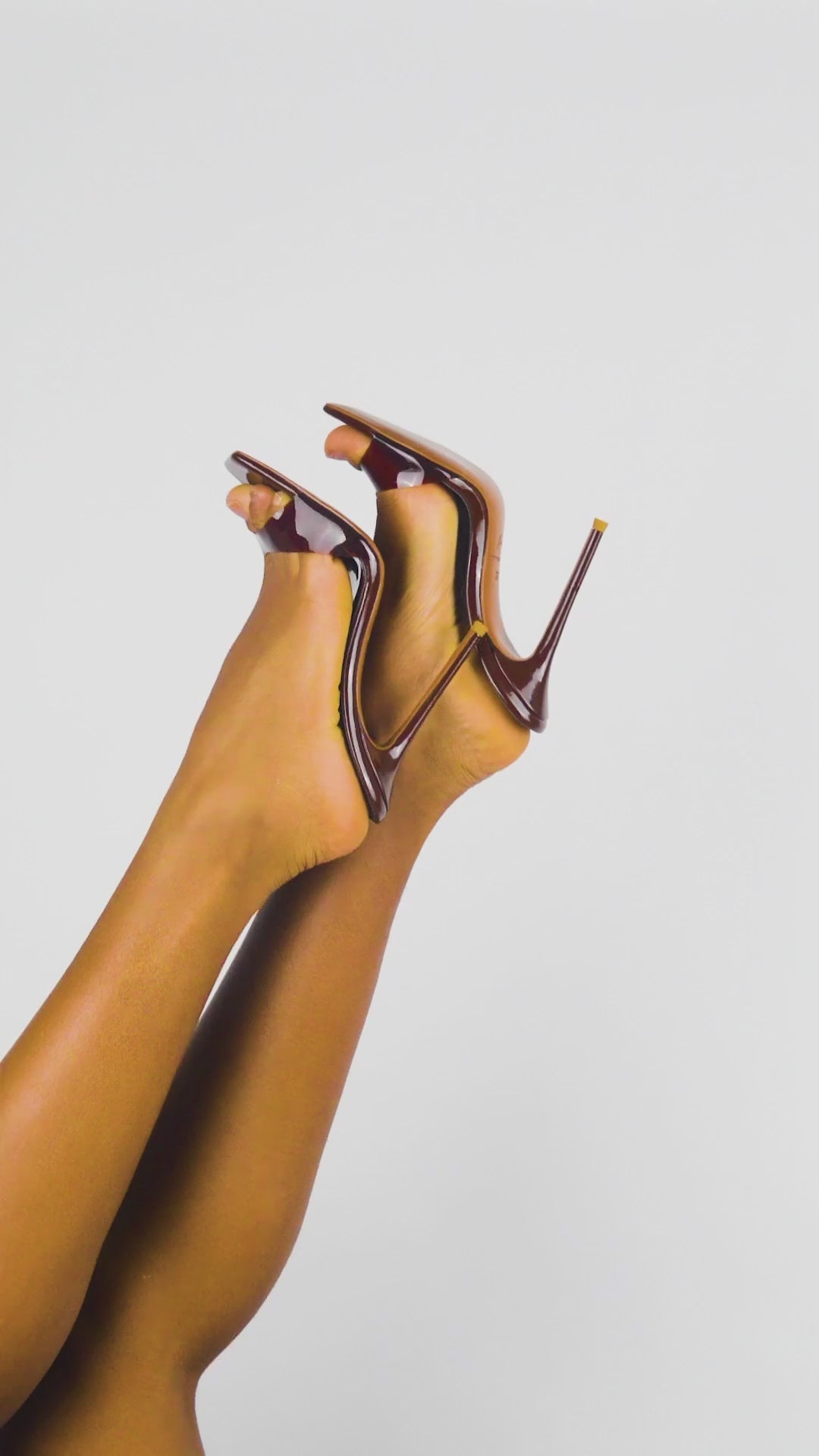 Top view of choco mules with glossy footbed and clear vinyl strap
