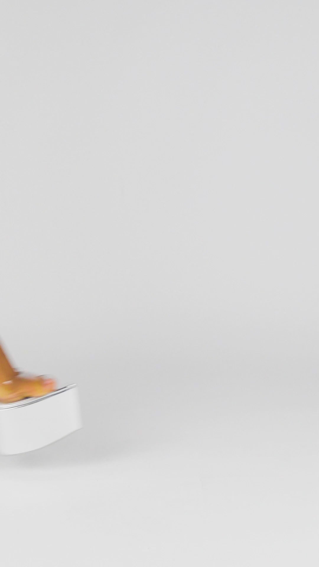 Top view of silver patent platform mules with see-through strap and sculpted footbed