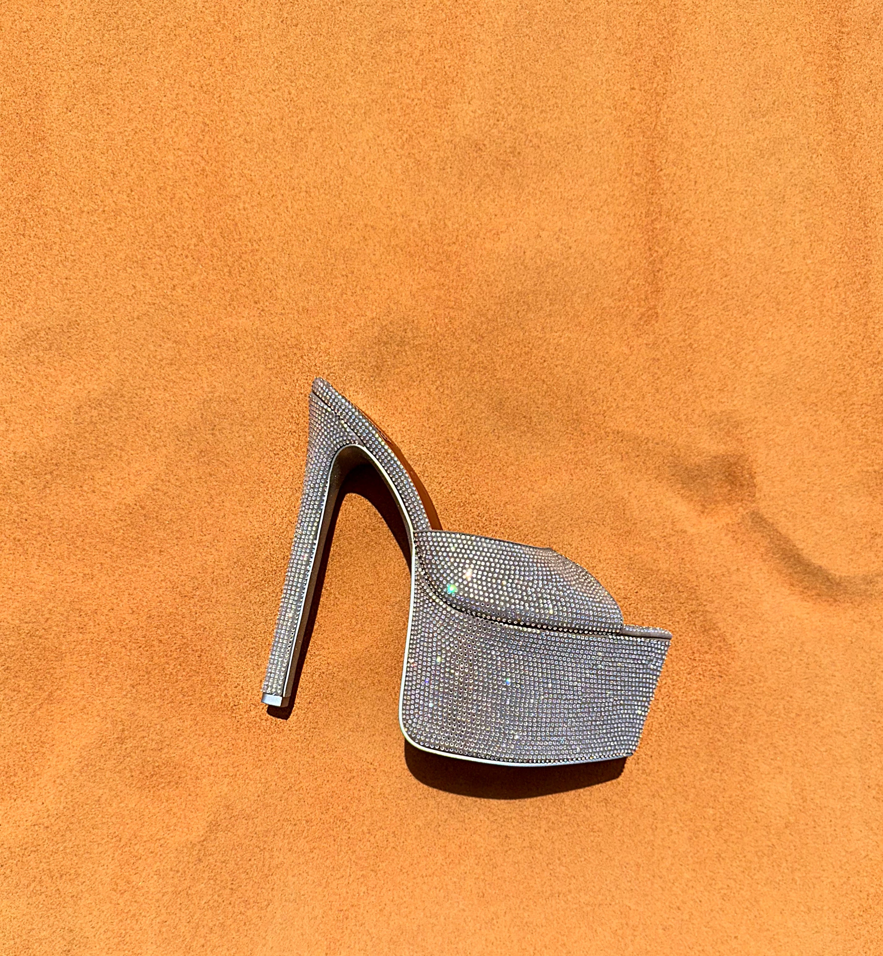  Side view of dazzling mules with bold platform sole